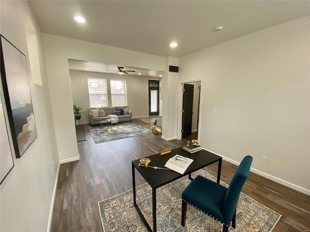 office with baseboards, wood finished floors, and a ceiling fan
