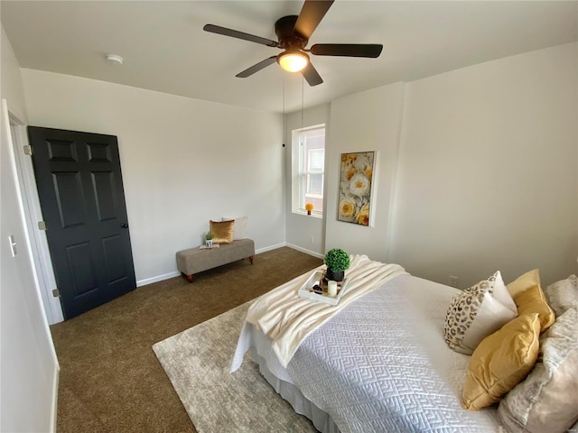 bedroom with ceiling fan, baseboards, and carpet