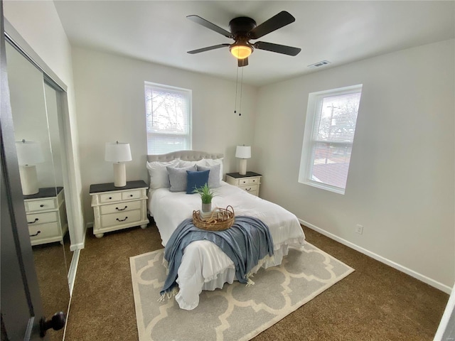 bedroom featuring a ceiling fan, carpet, visible vents, and baseboards