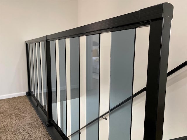 details featuring baseboards and carpet floors