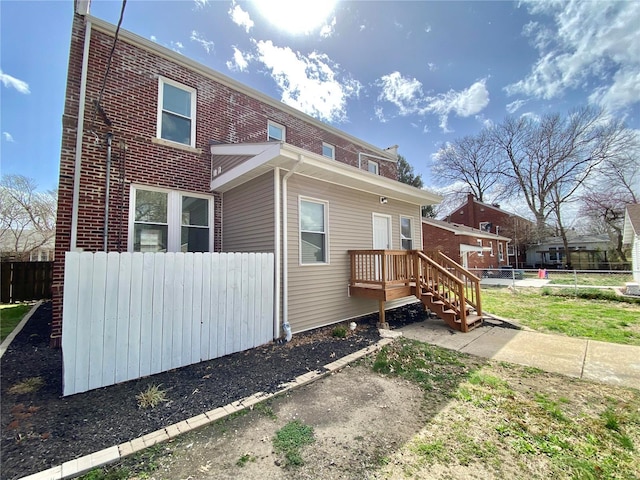 back of property with fence