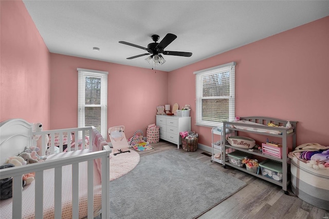 bedroom featuring ceiling fan and wood finished floors