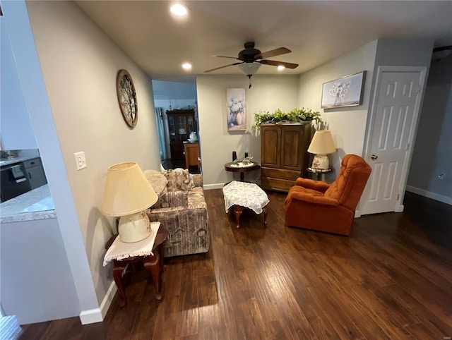 sitting room featuring baseboards, ceiling fan, wood finished floors, and recessed lighting
