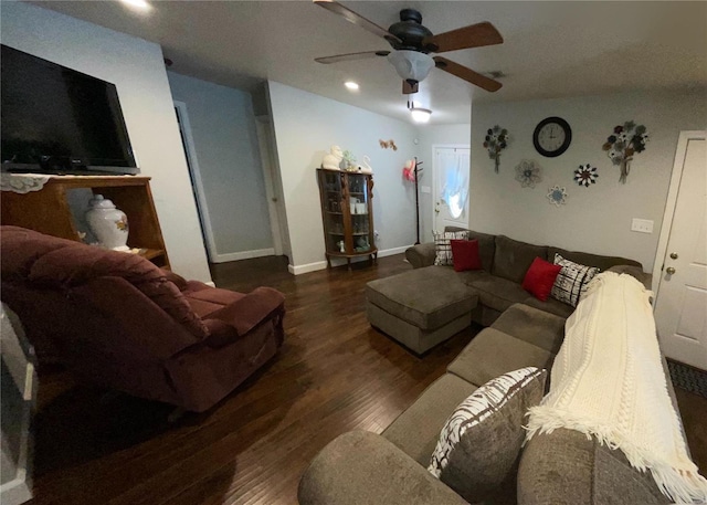 living area featuring baseboards, visible vents, wood finished floors, and a ceiling fan