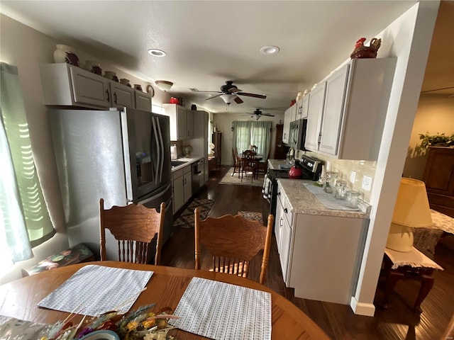 kitchen with recessed lighting, dark wood-style flooring, decorative backsplash, ceiling fan, and appliances with stainless steel finishes