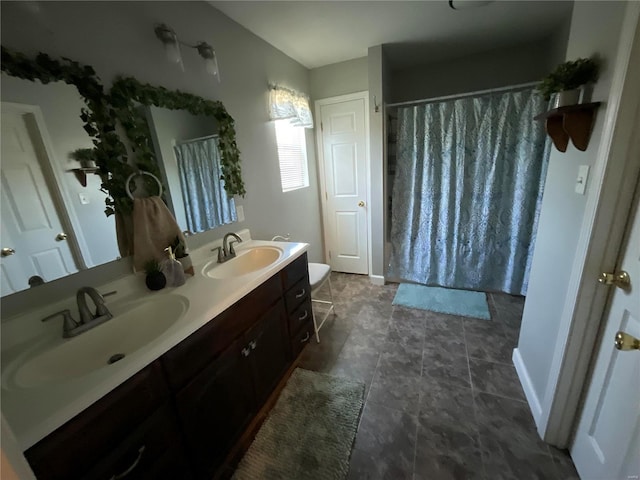 full bathroom featuring double vanity, a sink, and curtained shower