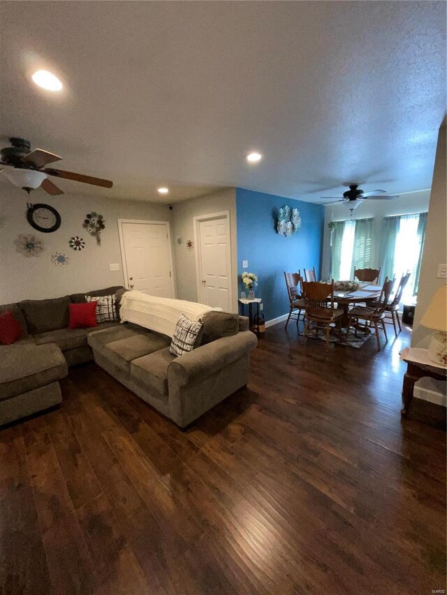 living area with a ceiling fan, recessed lighting, baseboards, and wood finished floors