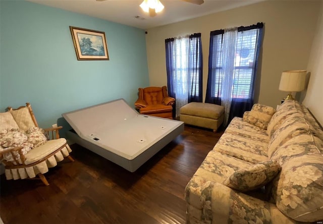 bedroom featuring dark wood-type flooring and a ceiling fan