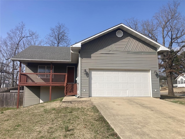 ranch-style house with fence, driveway, roof with shingles, an attached garage, and a front lawn