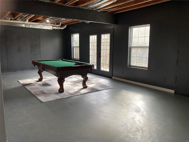 game room featuring billiards, finished concrete flooring, and french doors