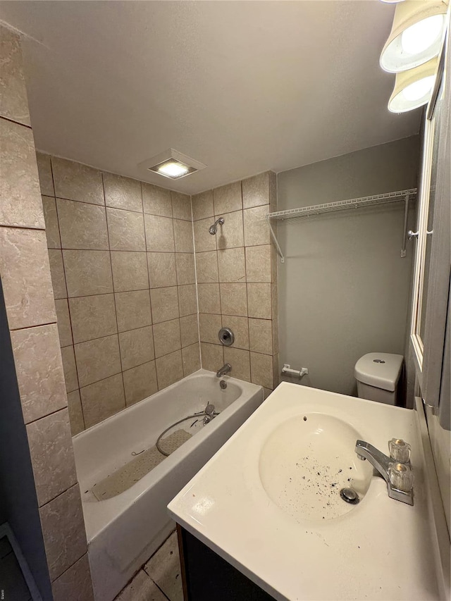 full bath featuring toilet, vanity, and washtub / shower combination