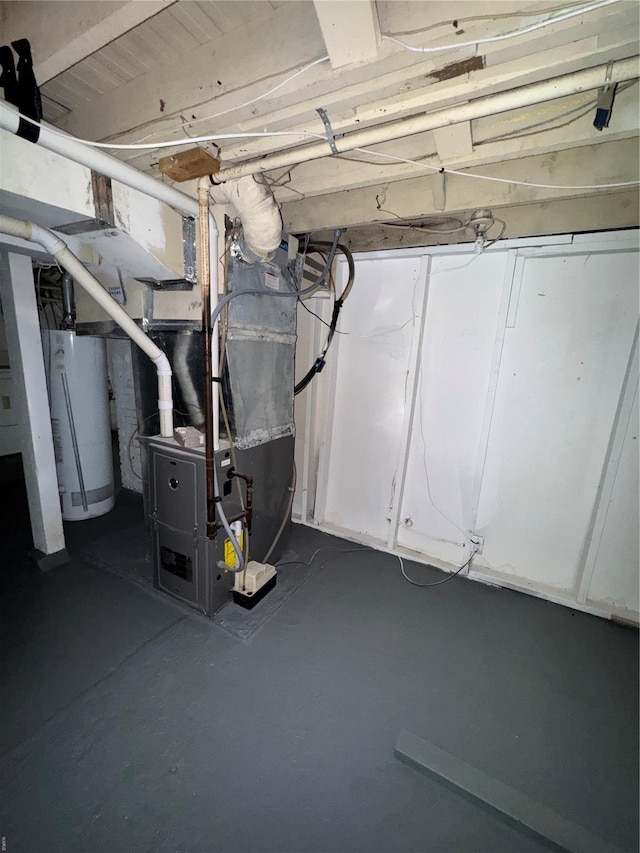 unfinished below grade area featuring heating unit and water heater