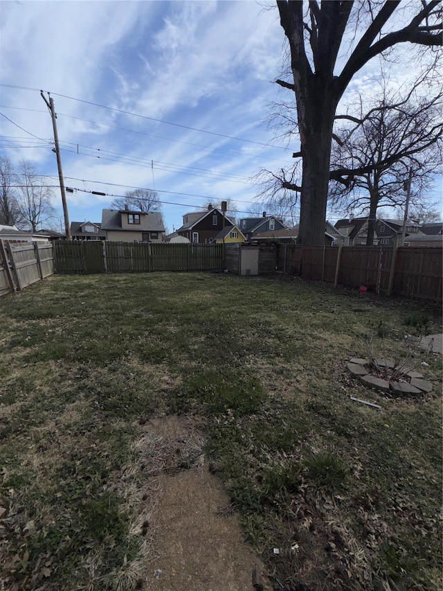 view of yard with a fenced backyard