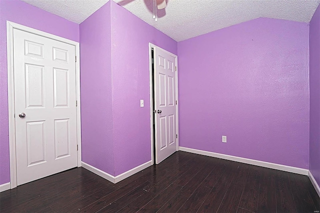 unfurnished bedroom featuring dark wood-type flooring and baseboards