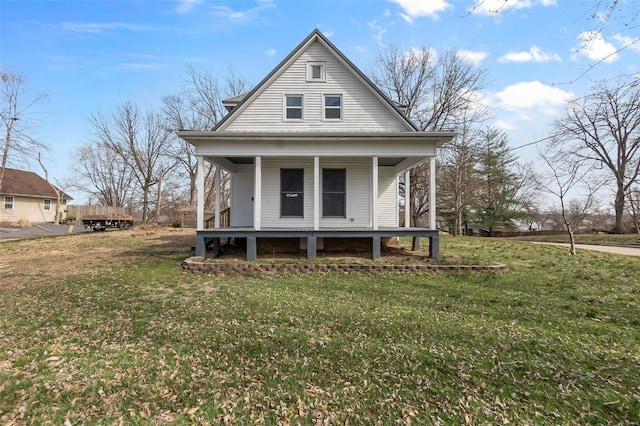 view of front of property with a porch and a front lawn