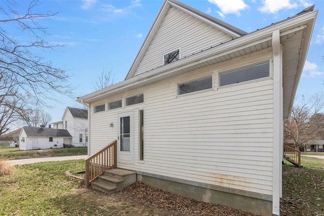 back of property featuring entry steps