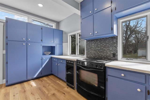 kitchen featuring blue cabinets, light wood-style floors, tasteful backsplash, and black range with electric cooktop