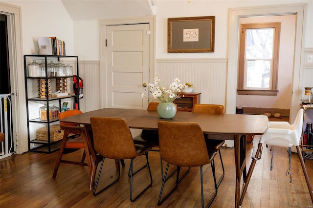 dining room featuring wood finished floors and wainscoting