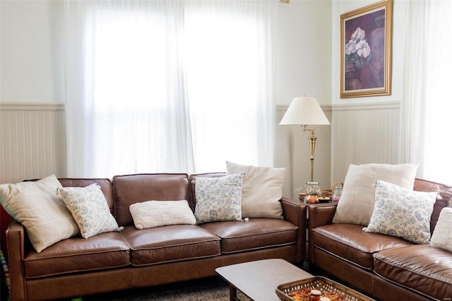 living room featuring wainscoting