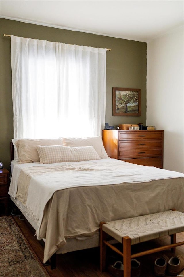 bedroom with wood finished floors