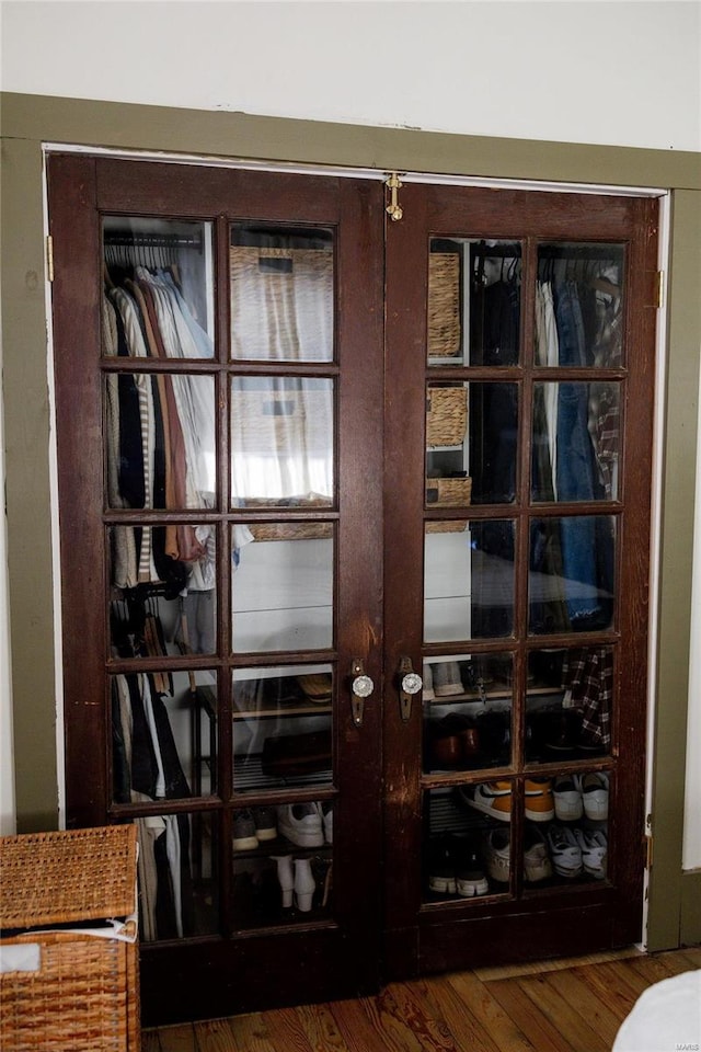 details with french doors and wood finished floors