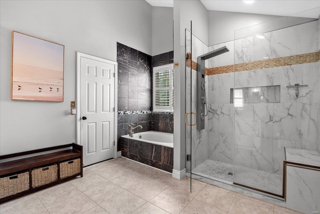 bathroom with a marble finish shower and a bath