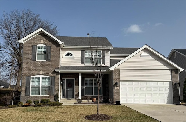 view of front of house featuring a front lawn, a garage, brick siding, and driveway