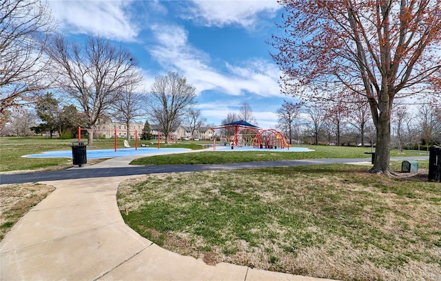 surrounding community featuring playground community and a yard