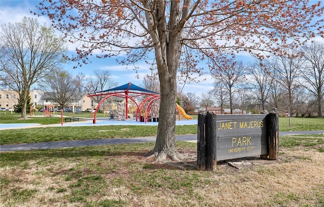 surrounding community featuring playground community and a yard