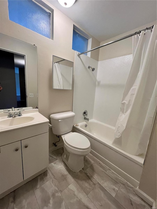 bathroom with toilet, vanity, and shower / bathtub combination with curtain