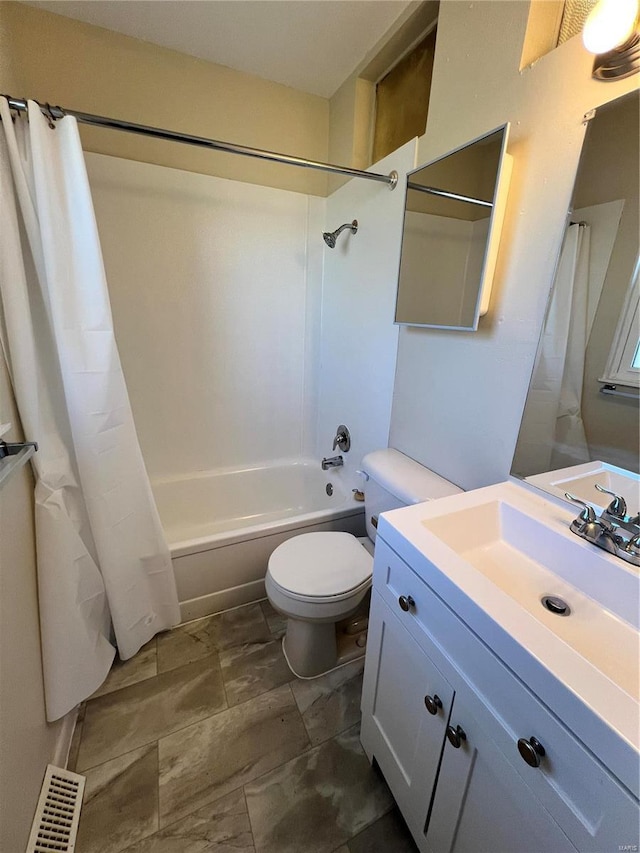 bathroom featuring vanity, shower / bath combination with curtain, and toilet