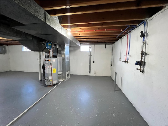 basement with electric panel, gas water heater, and heating unit
