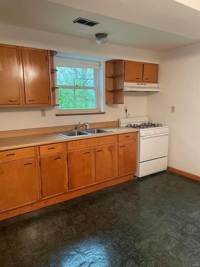 kitchen with visible vents, open shelves, a sink, gas range gas stove, and under cabinet range hood