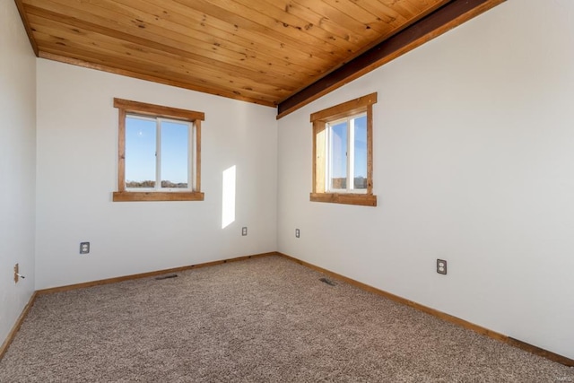 spare room with wood ceiling, baseboards, and carpet floors