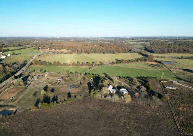 birds eye view of property with a rural view