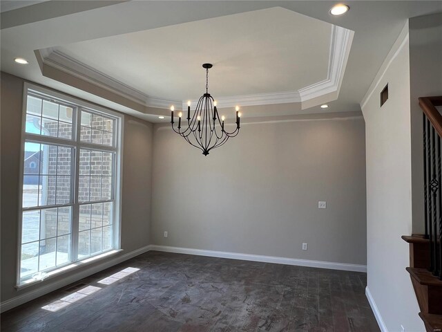 unfurnished dining area with a tray ceiling, a chandelier, plenty of natural light, and ornamental molding