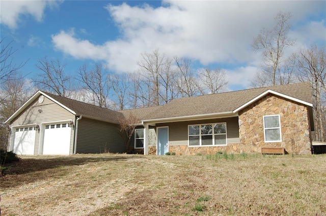 ranch-style house with stone siding, a front lawn, a garage, and roof with shingles