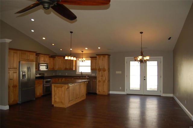 kitchen with ceiling fan with notable chandelier, dark wood finished floors, a center island, french doors, and appliances with stainless steel finishes
