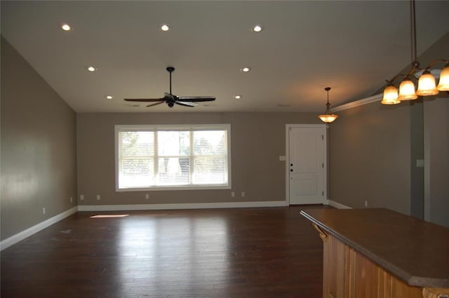 unfurnished living room featuring recessed lighting, baseboards, dark wood finished floors, and a ceiling fan