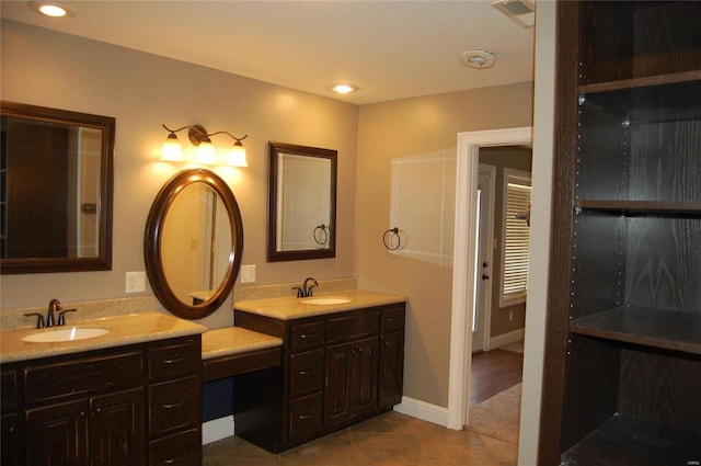 bathroom with tile patterned flooring, recessed lighting, vanity, and baseboards