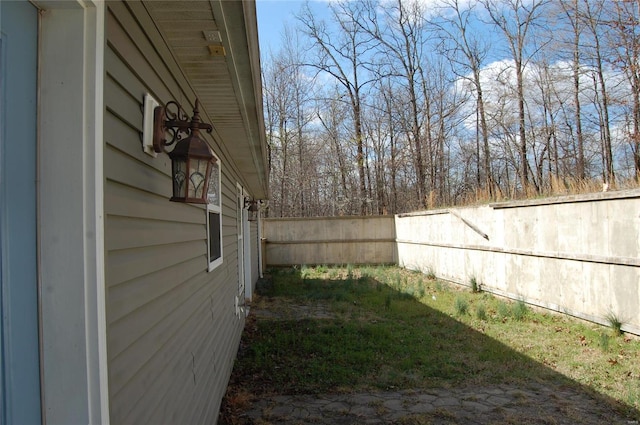 view of yard with a fenced backyard