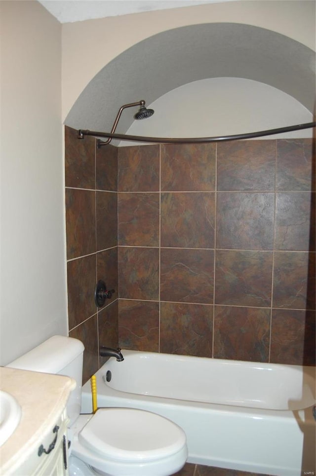 bathroom with vanity, toilet, and shower / bathtub combination