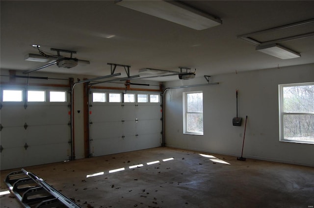 garage featuring baseboards and a garage door opener