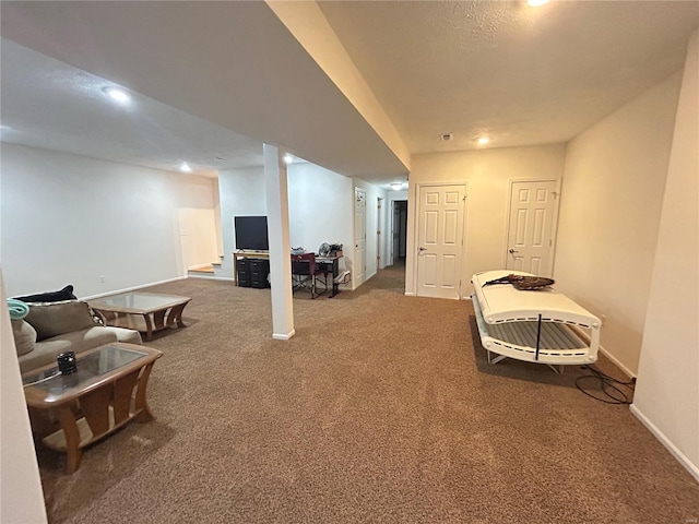 finished below grade area featuring carpet flooring and baseboards