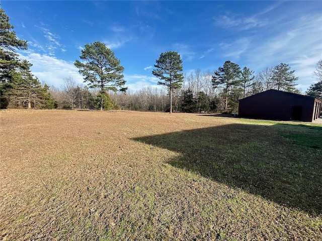 view of yard with an outbuilding and an outdoor structure
