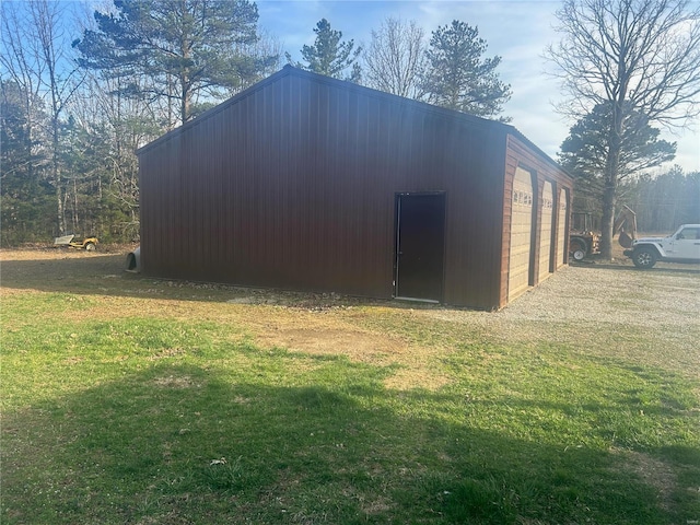 view of outbuilding featuring a garage and an outdoor structure