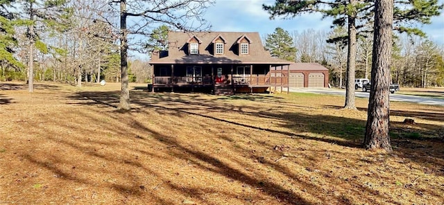 view of front of house featuring an outbuilding and covered porch