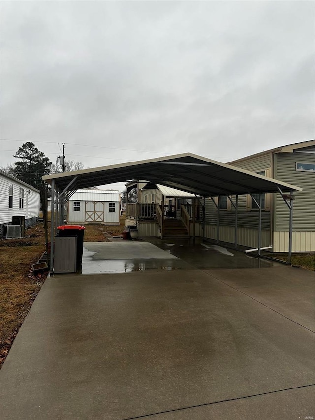 view of vehicle parking featuring a carport and concrete driveway