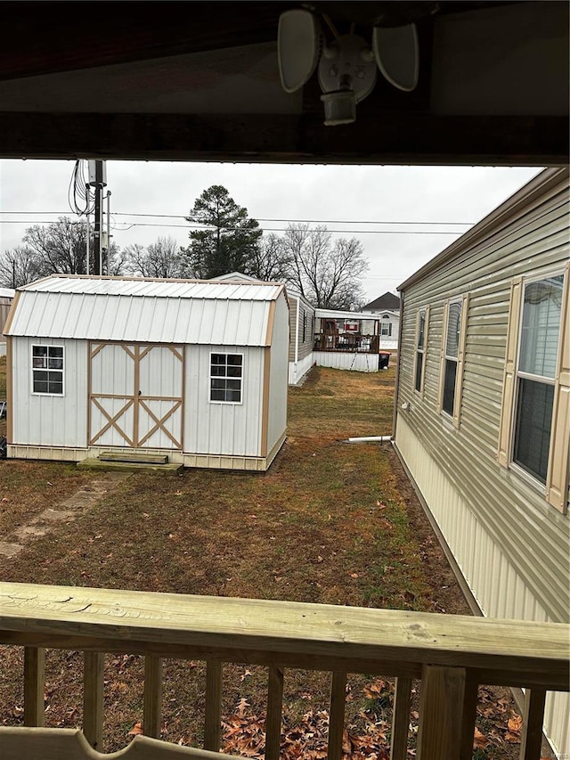 view of yard featuring an outbuilding and a storage unit
