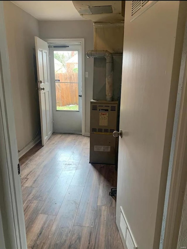 interior space featuring wood finished floors and visible vents